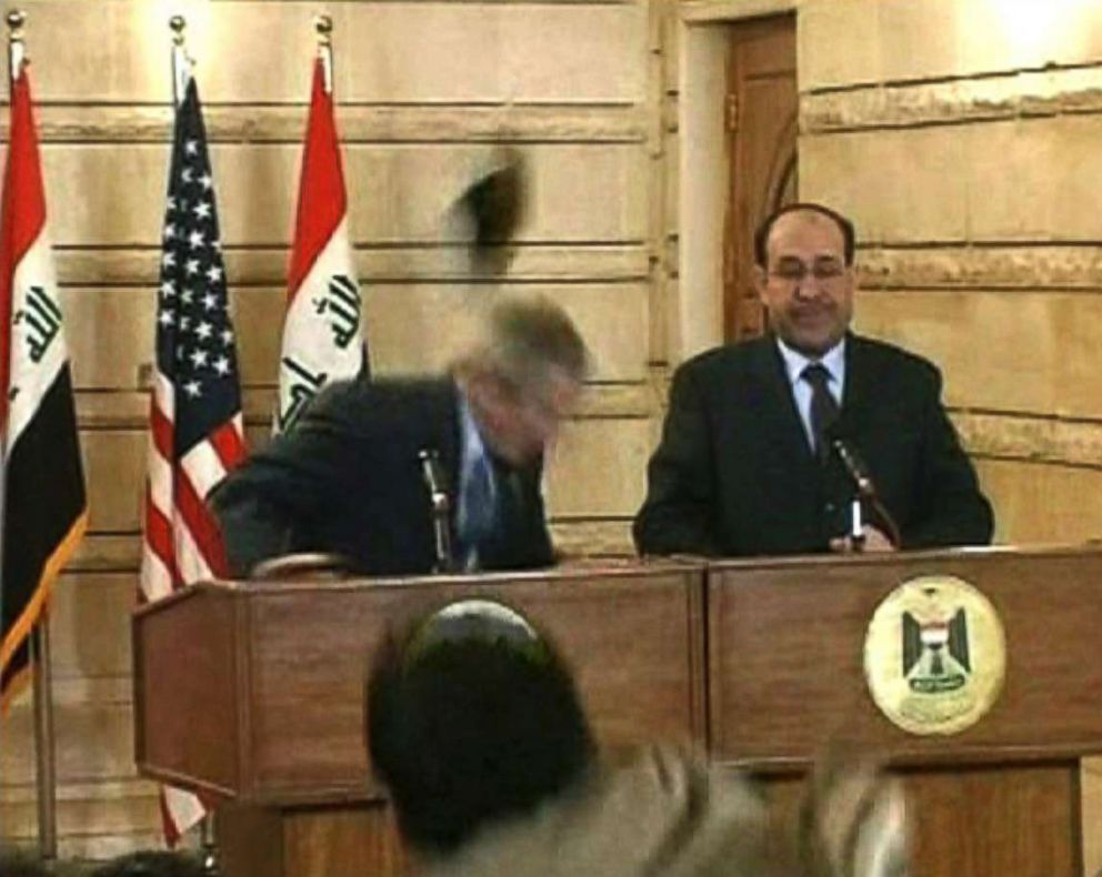 Iraqi journalist throws shoes at U.S. President George W. Bush during Baghdad visit